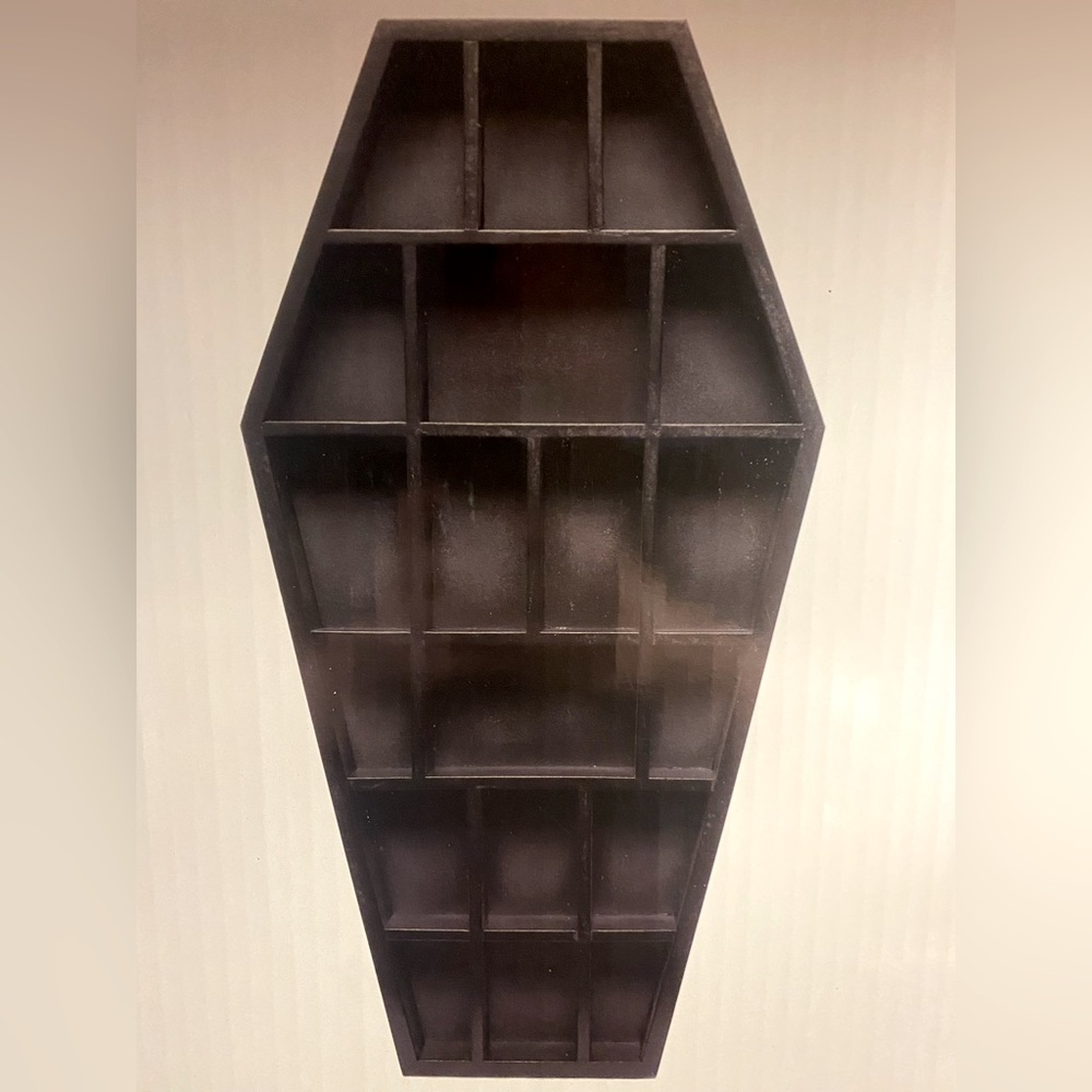 Sourpuss black coffin curio shelf